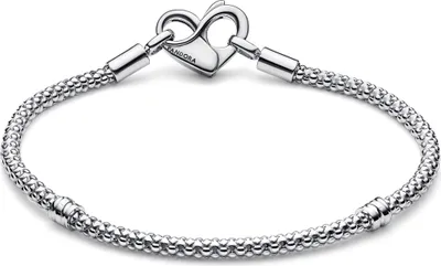 A silver Pandora bracelet with a heart-shaped clasp is displayed against a white background.