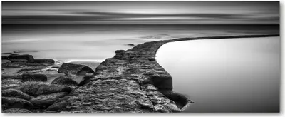 Produktbild von Tulup® Leinwandbild - 125x50 cm - Wandkunst - Drucke auf Leinwand - Leinwanddruck  - Landschaften - Schwarzweiß - Kiesstrand