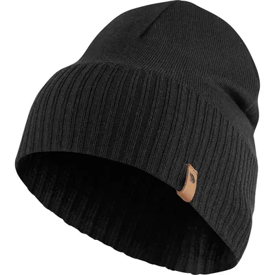 A black knitted beanie with a brown leather tag.