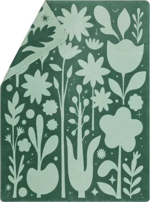 A blanket with an abstract floral pattern.