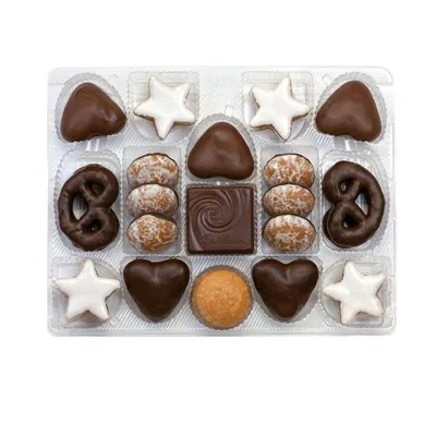 A clear, top-down view of a box of assorted Christmas cookies.