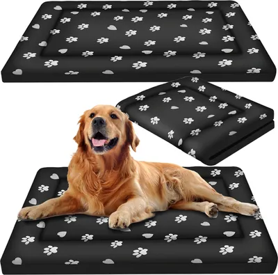 A golden retriever dog lying on a black dog mat with paw prints, with two other dog mats shown above and to the side.