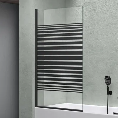 A shower screen with a striped pattern is installed over a bathtub in a bathroom.