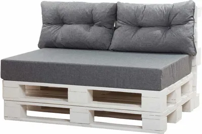 A pallet sofa with gray cushions on a white background.