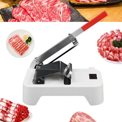 A manual meat slicer with various cuts of meat displayed around it.