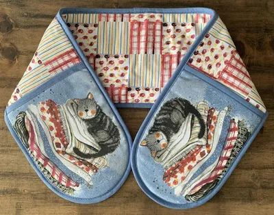 Produktbild von Küchenhandschuhe GLV01 Katze auf Wäschekorb