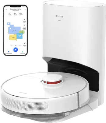 A white robot vacuum cleaner with a self-emptying base and a smartphone displaying its app interface.