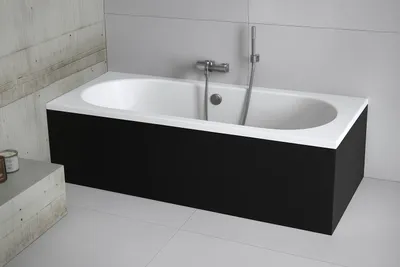 A modern bathroom with a bathtub.