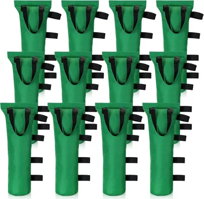 A grid of green sandbags with black handles and straps against a white background.