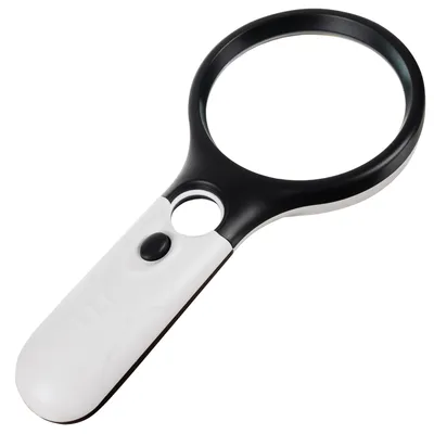 A close-up studio shot of a black and white LED-illuminated magnifying glass against a white background.