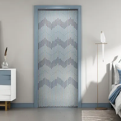 A beaded curtain hangs in a doorway, with a dresser and a floor lamp visible in the room.