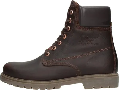 A side view of a single brown leather boot.
