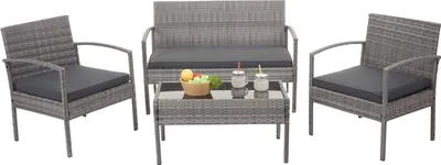A poly-rattan furniture set, including a loveseat, two chairs, and a coffee table, arranged on a white background.