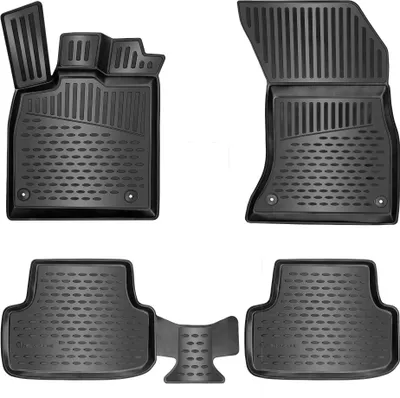 A set of black rubber car floor mats arranged on a white background.