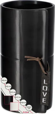 A black ceramic vase with a leather tie and tag.