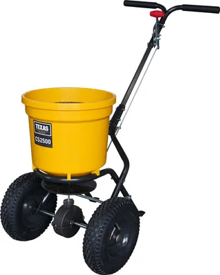 A yellow and black push spreader on a white background.