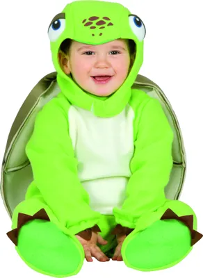A baby wearing a green turtle costume.