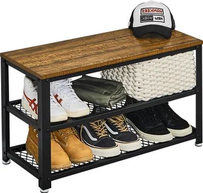 A shoe rack bench with various shoes and a basket on top.