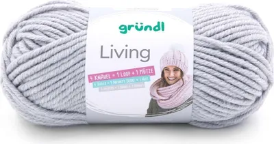 A ball of light gray yarn with a label showing a woman wearing a pink scarf and hat.