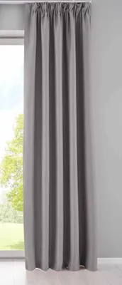 A gray curtain hanging in front of a window.