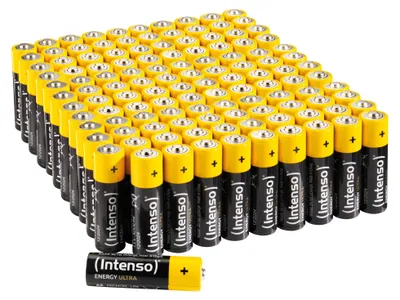 A large group of AA batteries are neatly arranged in rows, with one battery in the foreground.