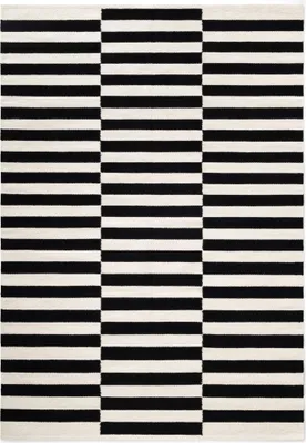 A flat lay of a rectangular rug with a black and white striped pattern.