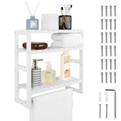 A white wooden bathroom shelf with various items like soap dispensers, towels, and toiletries.