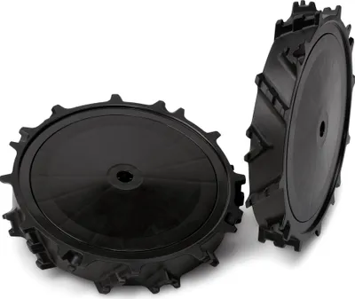 Two black plastic wheels with a tread pattern are shown against a white background.