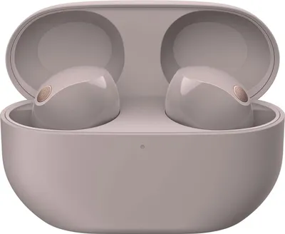 A pair of pink Sony WF-1000XM5 in-ear headphones are shown inside their charging case.