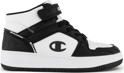 A studio shot of a single black and white Champion mid-top sneaker.