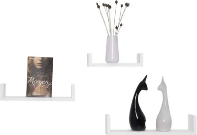 Three white U-shaped shelves are displayed on a white background. The top shelf holds a white vase with dried flowers. The middle shelf holds a book. The bottom shelf holds two decorative cat figurines, one black and one white.