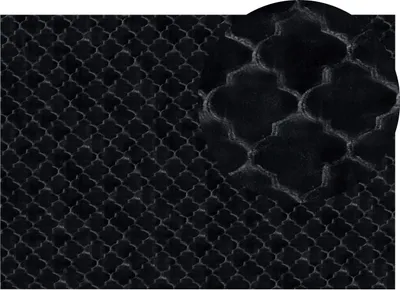 A close-up view of a black carpet with a Moroccan-inspired pattern.