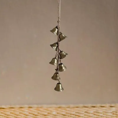 Image de Crochet décoratif « Klok » en bronze pour carillon éolien.