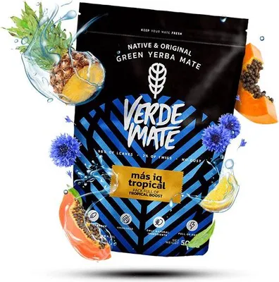 A bag of Verde Mate Green Yerba Mate with tropical fruits and flowers surrounding it.