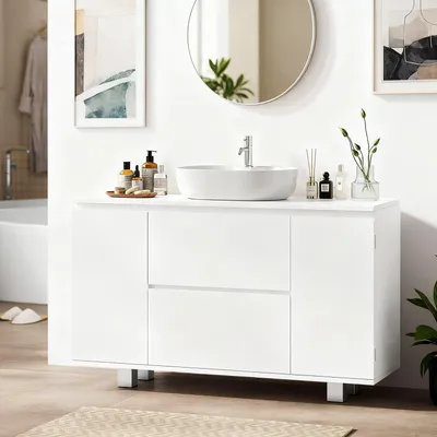 A white bathroom vanity with a vessel sink and faucet.