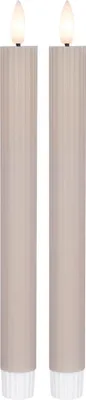 Two beige LED candles with white bases and illuminated tops are shown against a white background.