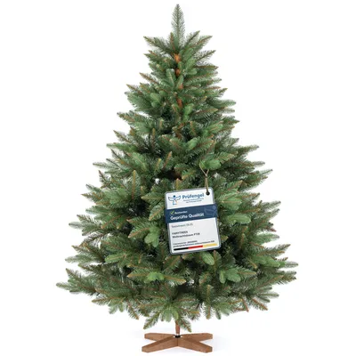 A full shot of an artificial Christmas tree on a white background.