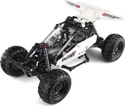 A white and black remote-controlled desert racing buggy, shown from a three-quarter front angle on a white background.