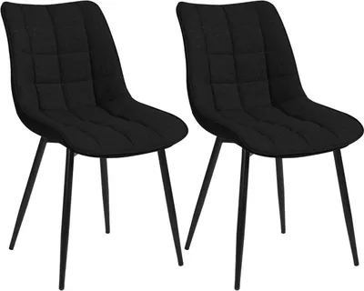 Two black dining chairs are shown against a white background.