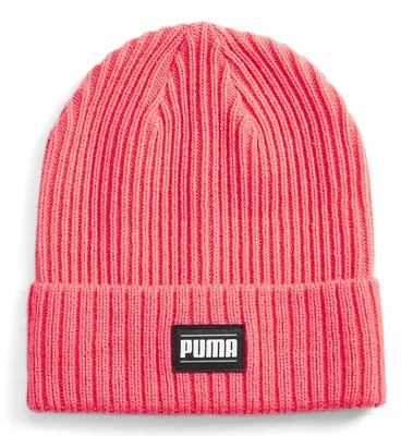 A pink ribbed beanie with a black Puma logo patch.