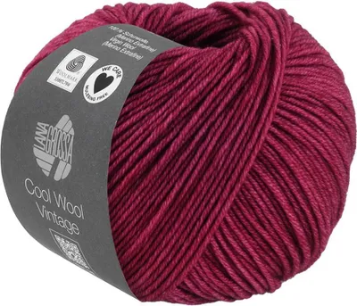 A ball of red yarn with a label wrapped around it.