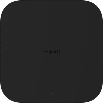 A top-down view of a black Aqara Hub M3 device.