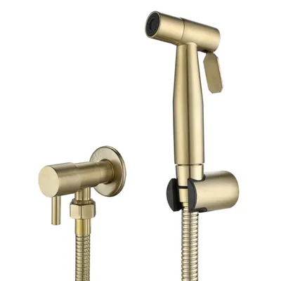 A gold-colored bidet sprayer set is displayed against a white background. The set includes a hand sprayer, a wall-mounted holder, and a valve.