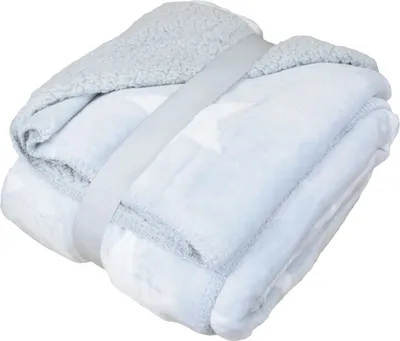 A folded blanket with a star pattern, held together by a strap.