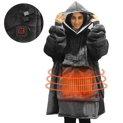 A person wearing a large, hooded blanket with a heating element.