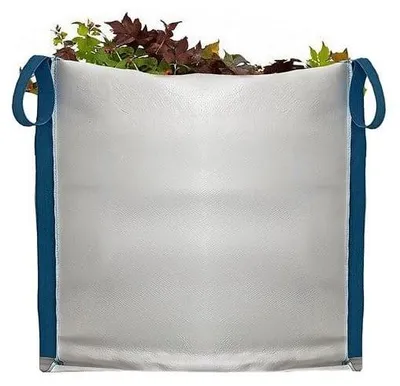 A large white bag filled with leaves and branches.