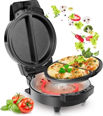 An open omelette maker with cooked omelettes inside, with ingredients flying around it and tomatoes and basil in the foreground.