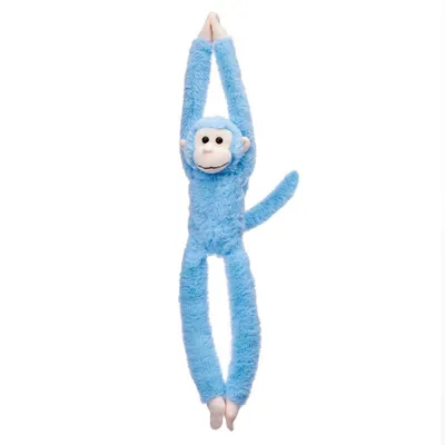 A blue plush monkey toy hanging by its arms against a white background.