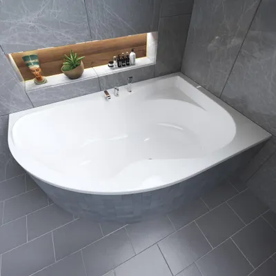 A modern bathroom with a corner bathtub.