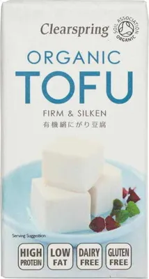 A package of Clearspring Organic Tofu with a serving suggestion of tofu cubes on a plate.